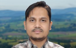 Profile photo of Sarwar Nizam in front of a blurred landscape.