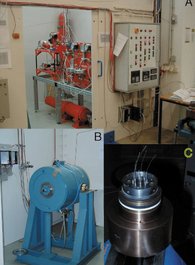 A: Control unit of Harwood IHPV (foreground); 2-stage pressure unit (orange) is visible in background. Pressure vessel (shown in B) is situated left of the pressure unit. When the equipment is in use, door is closed for safety reasons. C: Detail of "back-side" closure plug with electrical leads for furnace and thermocouples.