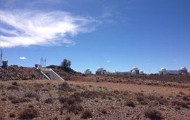 The photo shows the South African Astronomical Observatory (SAAO) with its numerous telescopes and SAGOS.