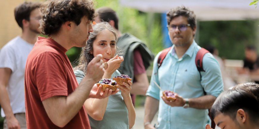 Several people eat ice cream