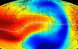 World map with outlines of the continents. Above, billowing colour clouds representing different electron densities of the ionosphere.