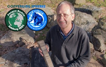 Achim Brauer looks into the camera while holding a prepared sediment core in his hands.