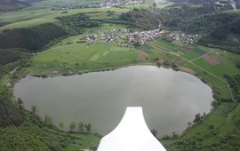 You see a lake photographed from an aeroplane